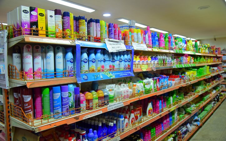 Shelves of branded detergents and cleaners